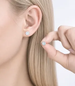 Close-up of minimalist S925 silver round earrings with iridescent mother of pearl inlay