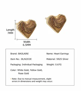 Detail view of heart stud earrings in brown marble and gold finish with size annotations