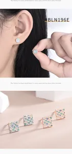 Detail of s925 silver geometric stud earrings with colorful grid patterns and metal base