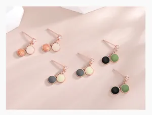 Detail of S925 silver rose gold earrings with enamel discs and cubic zirconia