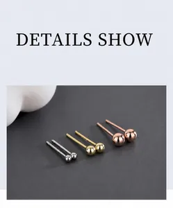 Detailed view of polished S925 sterling silver ball stud earrings in silver, gold, and rose gold