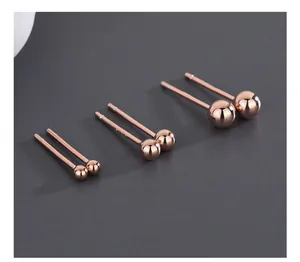 Detail of rose gold S925 sterling silver ball earrings in three different sizes