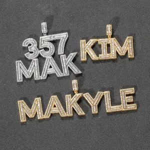 Macro view of gold and silver hip-hop letter pendants with iced out zircon stones