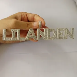 Detailed view of the copper-set cubic zirconia LIL ANDEN hip hop letter pendant