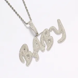 Hip hop silver tone necklace featuring large ice out BABY letter pendant on rope chain