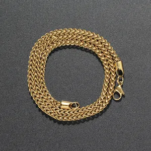 Close-up of a 3mm gold stainless steel wheat chain with a secure lobster clasp