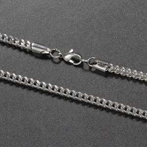 Macro view of 3mm stainless steel chain showing polished links and lobster clasp detail