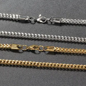 Detailed macro view of 3mm gold and silver wheat chains with polished lobster clasps
