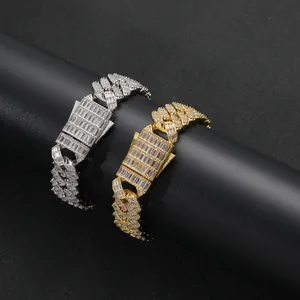 Macro detail of gold and silver cuban link bracelets with square-cut zirconia buckle