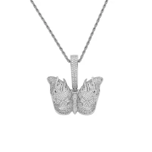 Close-up of hip-hop butterfly skull pendant with white zircons on silver rope chain