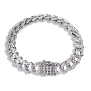 Detail of 12mm silver cuban link bracelet with baguette-cut cubic zirconia stones