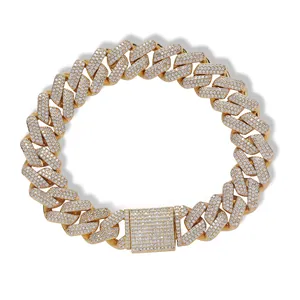 Close-up of 13mm iced out gold Cuban link bracelet with square clasp and white zircons