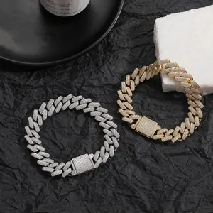 Close-up of gold and silver Miami Cuban bracelets with micro-pave AAA zircons