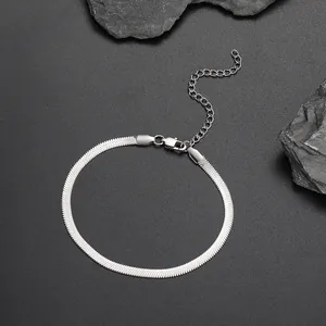 Detail of a 4mm flat silver snake chain anklet with adjustable lobster clasp closure