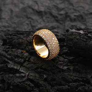 Macro shot of 11mm gold hip hop ring with five rows of sparkling cubic zirconia