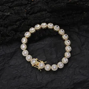 Macro shot of 8mm gold tennis bracelet with iced-out round zircon and folding clasp