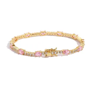 Gold tennis bracelet with pink oval stones and white cubic zirconia accents for women