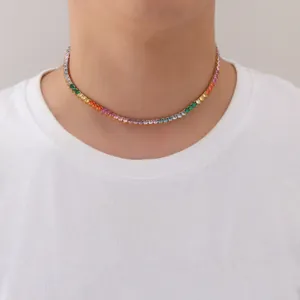 Close-up of a vibrant rainbow tennis choker necklace with multi-colored gemstones on a model