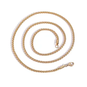 Macro shot of 3mm golden stainless steel wheat chain with durable lobster clasp detail