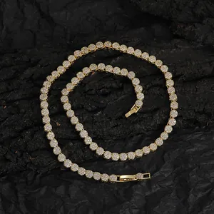 Detail of 5mm gold hip hop tennis chain with round zirconia in S-curve on wood