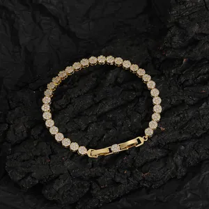 Detailed macro view of 5mm gold-plated tennis chain with pave-set zircon stones