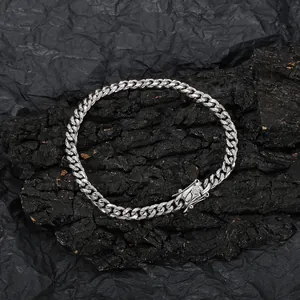 Polished silver stainless steel Cuban link anklet featuring a crystal-encrusted safety clasp