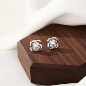 Elegant silver S925 camellia stud earrings with white enamel and center pearls