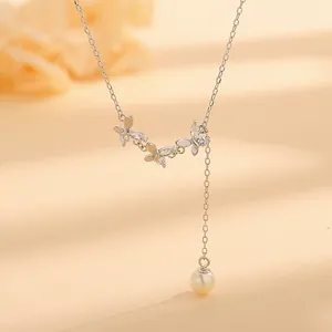 Elegant S925 silver necklace featuring zircon butterfly pendants and a pearl drop tassel