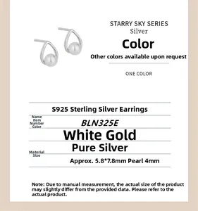Macro shot of S925 sterling silver hollow teardrop earrings with a small 4mm pearl