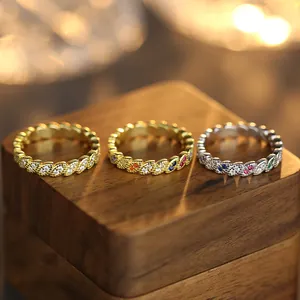 Three dainty stackable rings with colorful marquise zircons in gold and silver plating