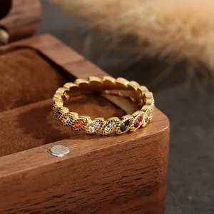 Chic gold wave ring with marquise rainbow cubic zirconia in a premium wooden box display