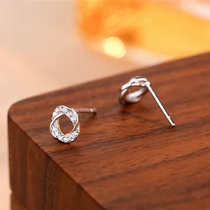 Elegant S925 sterling silver interlocking oval stud earrings with micro-pave cubic zirconia