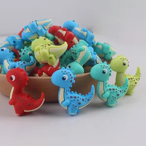 Detalle de cuentas de silicona de dinosaurio para clips de chupete DIY de bebé