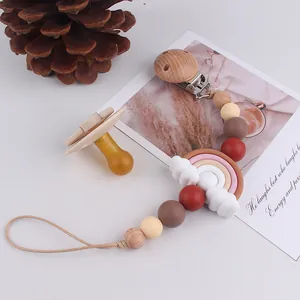 Detail of handmade silicone rainbow pacifier chain with natural wood and colorful beads