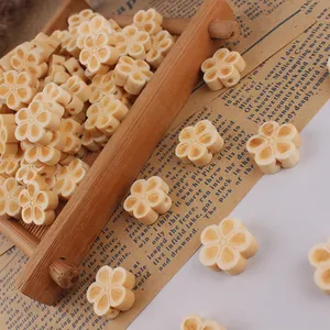 Plum blossom shaped wooden beads for DIY handmade jewelry crafts in creamy yellow