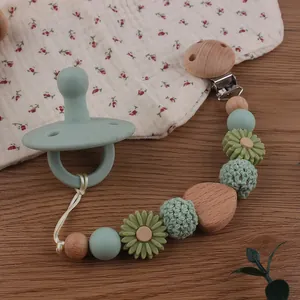 Beech wood and silicone baby pacifier clip with handmade beads in morandi green finish
