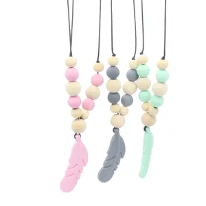 Collier de dentition bébé plume en silicone avec perles en bois rose, gris et menthe