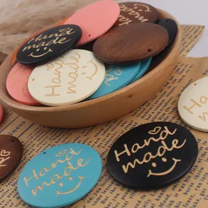 Round handmade wooden tags with Hand Made engraving and smiley face for DIY jewelry