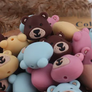 Close-up of matte bear head silicone beads with pre-drilled holes for DIY jewelry