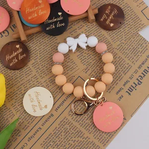 Handmade silicone bead keychain with love charm and white bow for Mother's Day gift