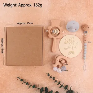 5-piece beech wood baby rattle set with silicone pacifier and milestone disk in a gift box