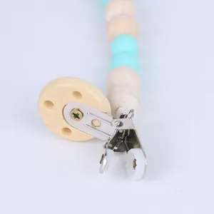 Baby wooden pacifier clip chain with natural wood and light blue silicone beads