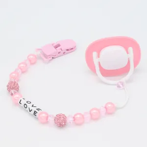 Pink pearl pacifier chain set with LOVE letter beads and glittery crystal accents