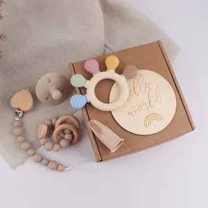 Detailed set of silicone pacifier clips and teething rings in a gift box