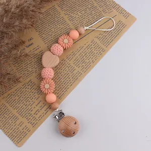 Beech wood and peach silicone pacifier clip with crochet beads and heart wood block