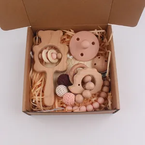 Five-piece baby beech wood bear rattle and pink silicone pacifier gift set in a box