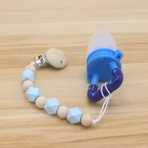 Kit grignoteuse bébé bleue avec tétine silicone et attache-sucette perles en bois naturel