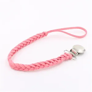 Detailed view of pink woven pacifier clip chain with silver metal spring buckle