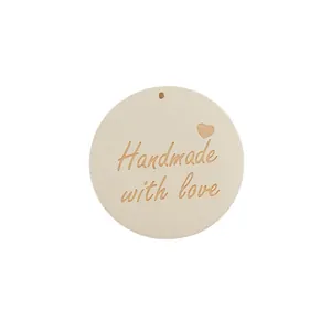 Handmade with love engraved round wooden tags with heart pattern for DIY jewelry crafts