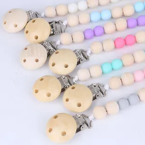 Natural wooden baby pacifier clips set with colorful silicone beads in macaron colors